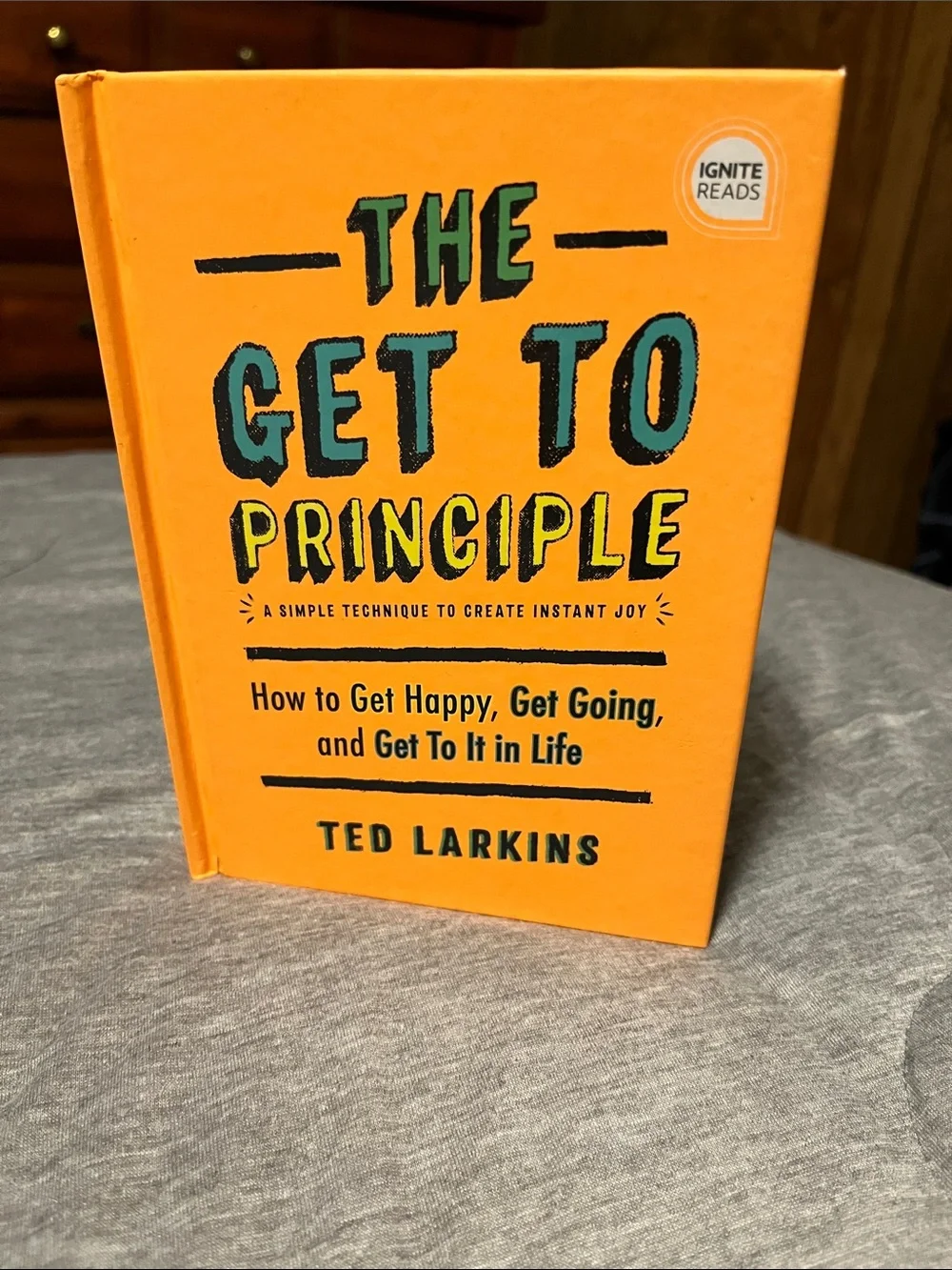 The Get To Principle by Ted Larkins - Bright Orange Hardcover